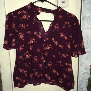 purple shirt with purple flowers.